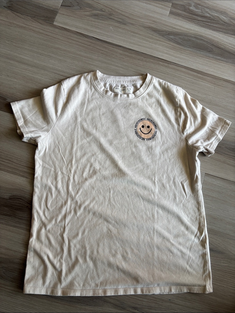 abercrombie kids Cream Short Sleeve Tee with Smiley Chest Graphic
